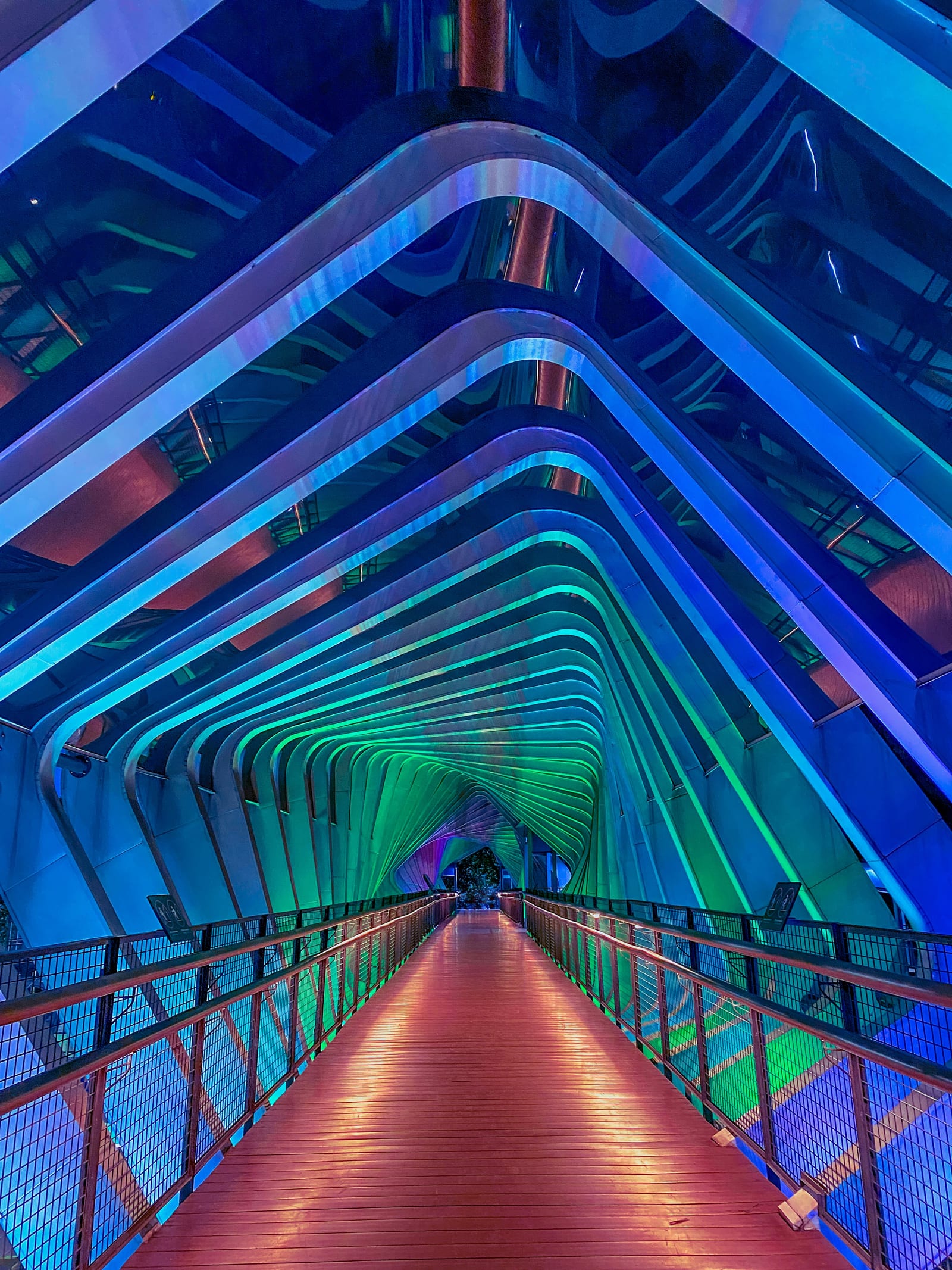 A brightly lit architectural walkway leading toward an entrance, representing entry into a new market